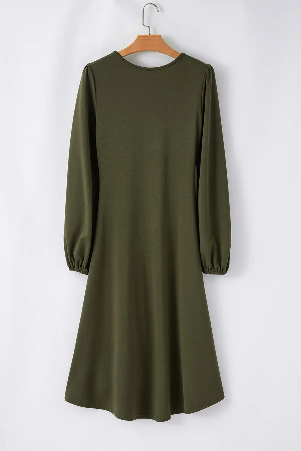 Jungle green long sleeve midi dress on a hanger, back view
