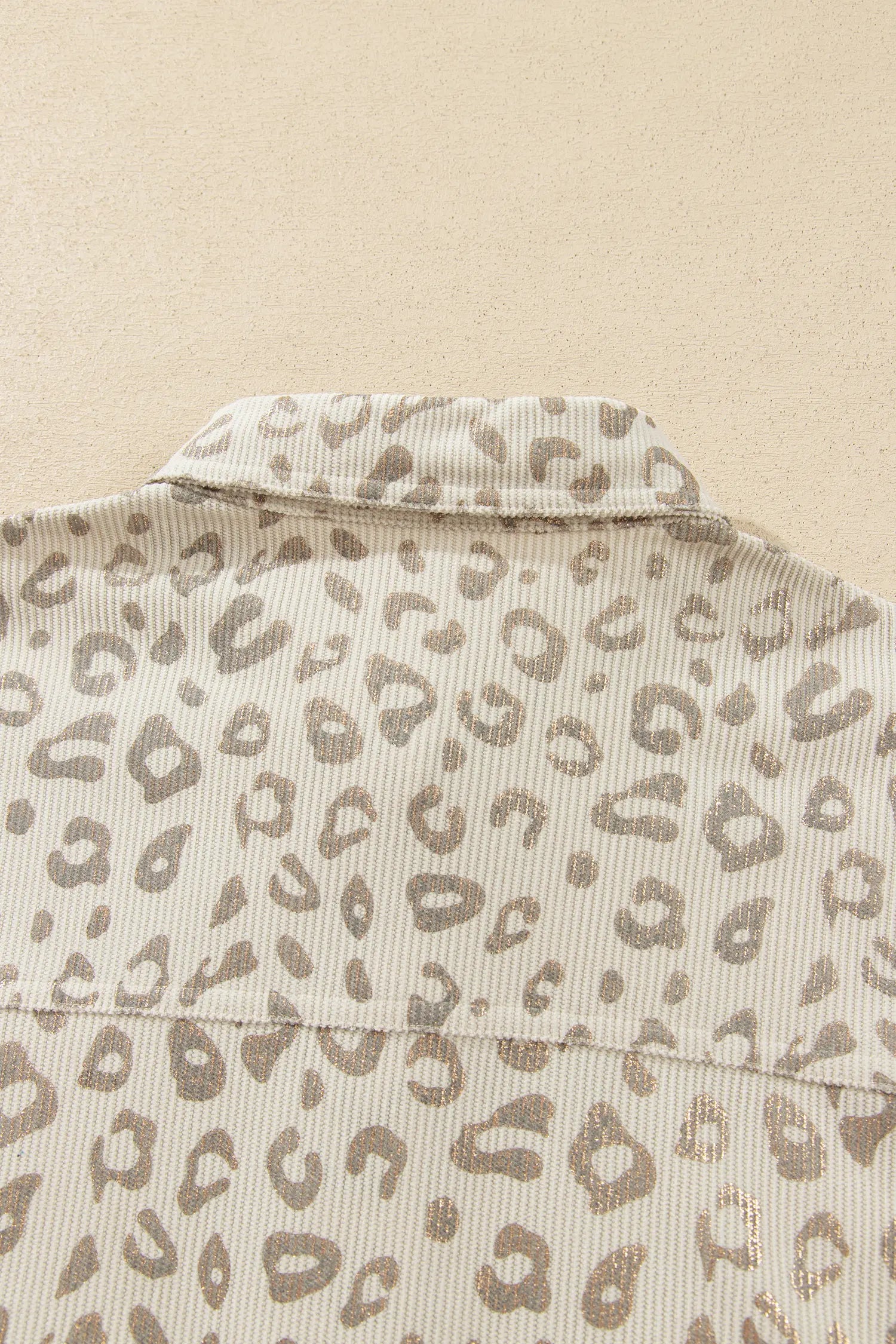 Back collar detail on khaki leopard corduroy jacket