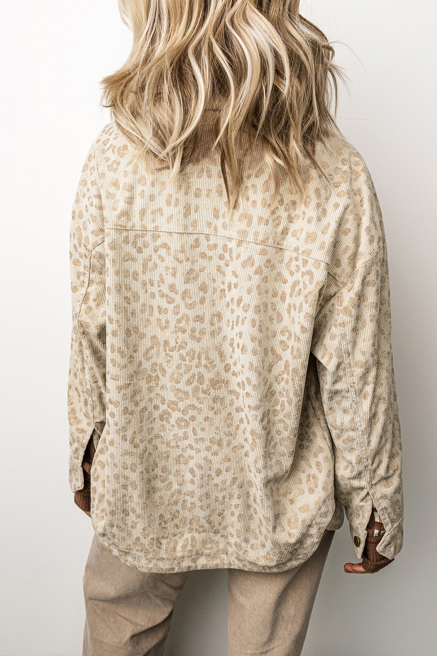Back view of khaki leopard print oversized corduroy shirt jacket