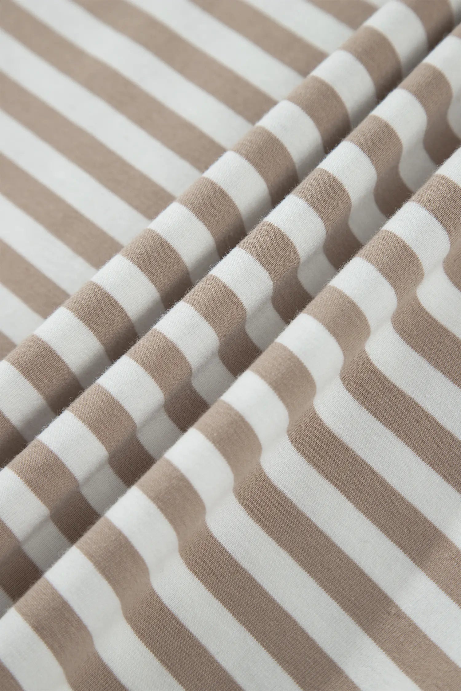 Close-up of soft khaki and white striped cotton knit