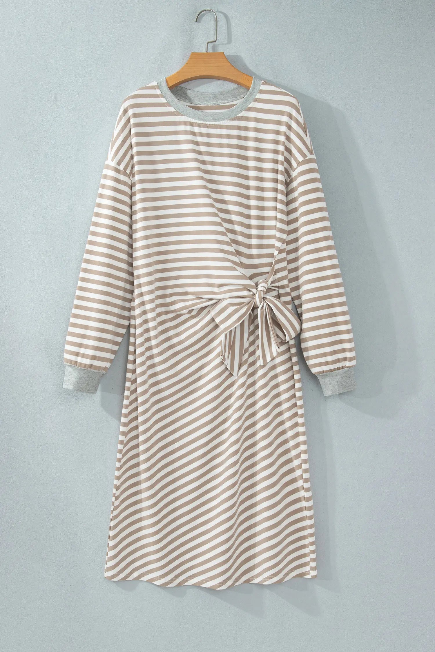 Khaki and white stripe tie waist midi dress with gray trim on a hanger, front view