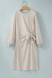 Khaki and white stripe tie waist midi dress with gray trim on a hanger, front view