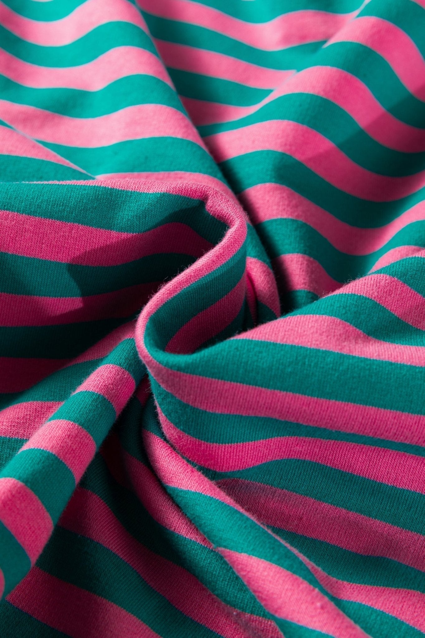 Close-up of pink and teal striped fabric