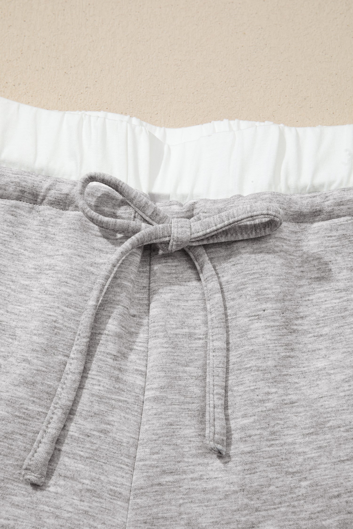 Gray wide leg pants white elastic waistband and drawstring detail
