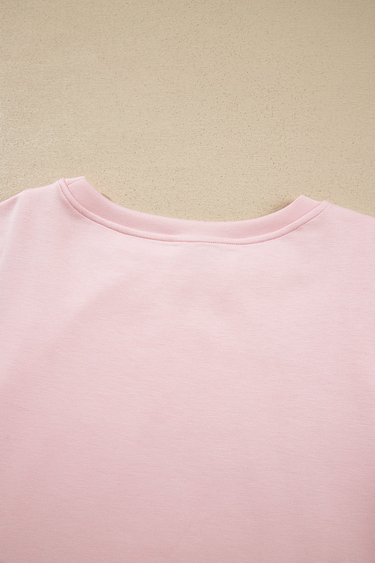 Pink crop top back neckline detail