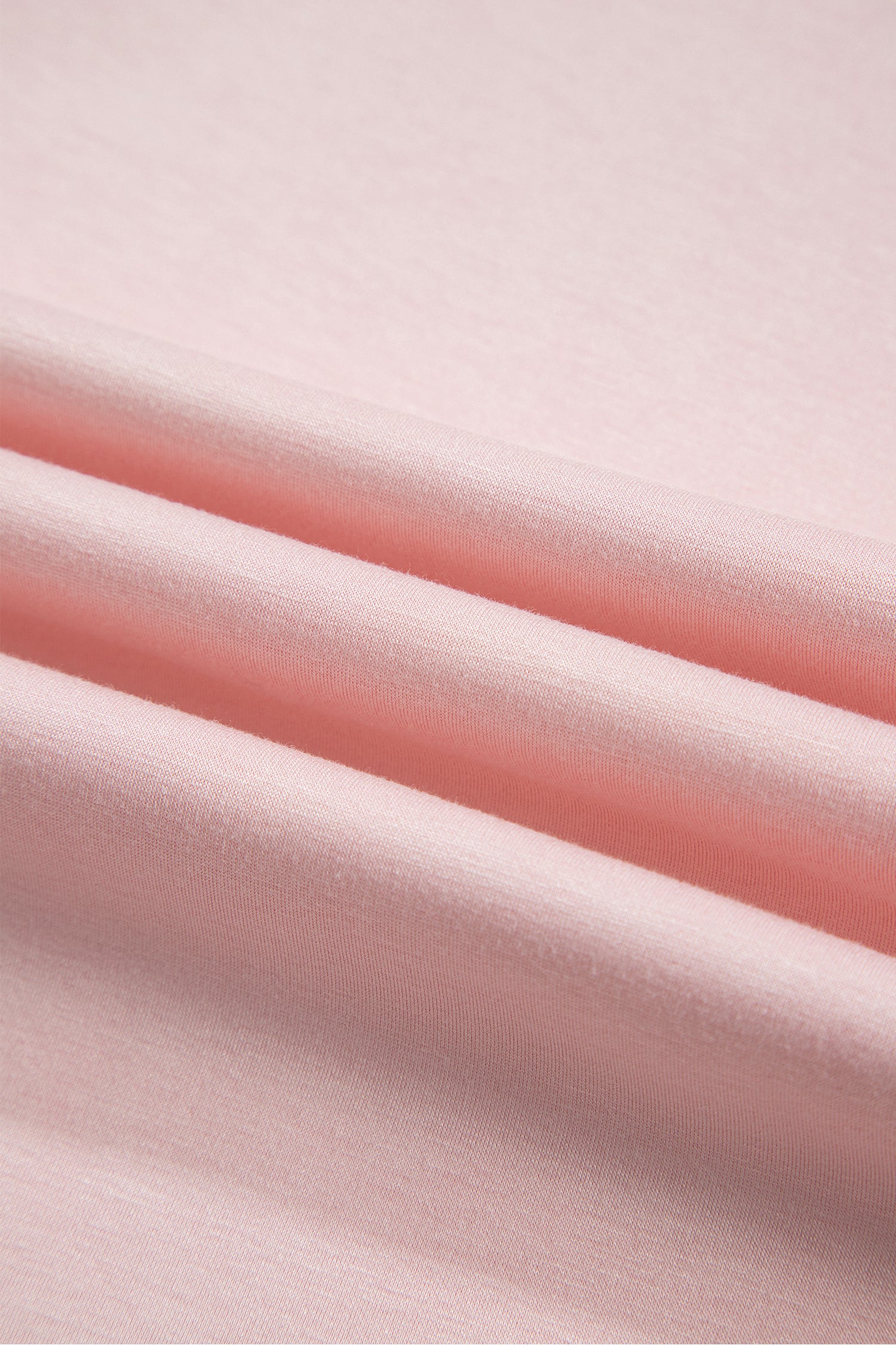 Close-up of soft pink knit fabric