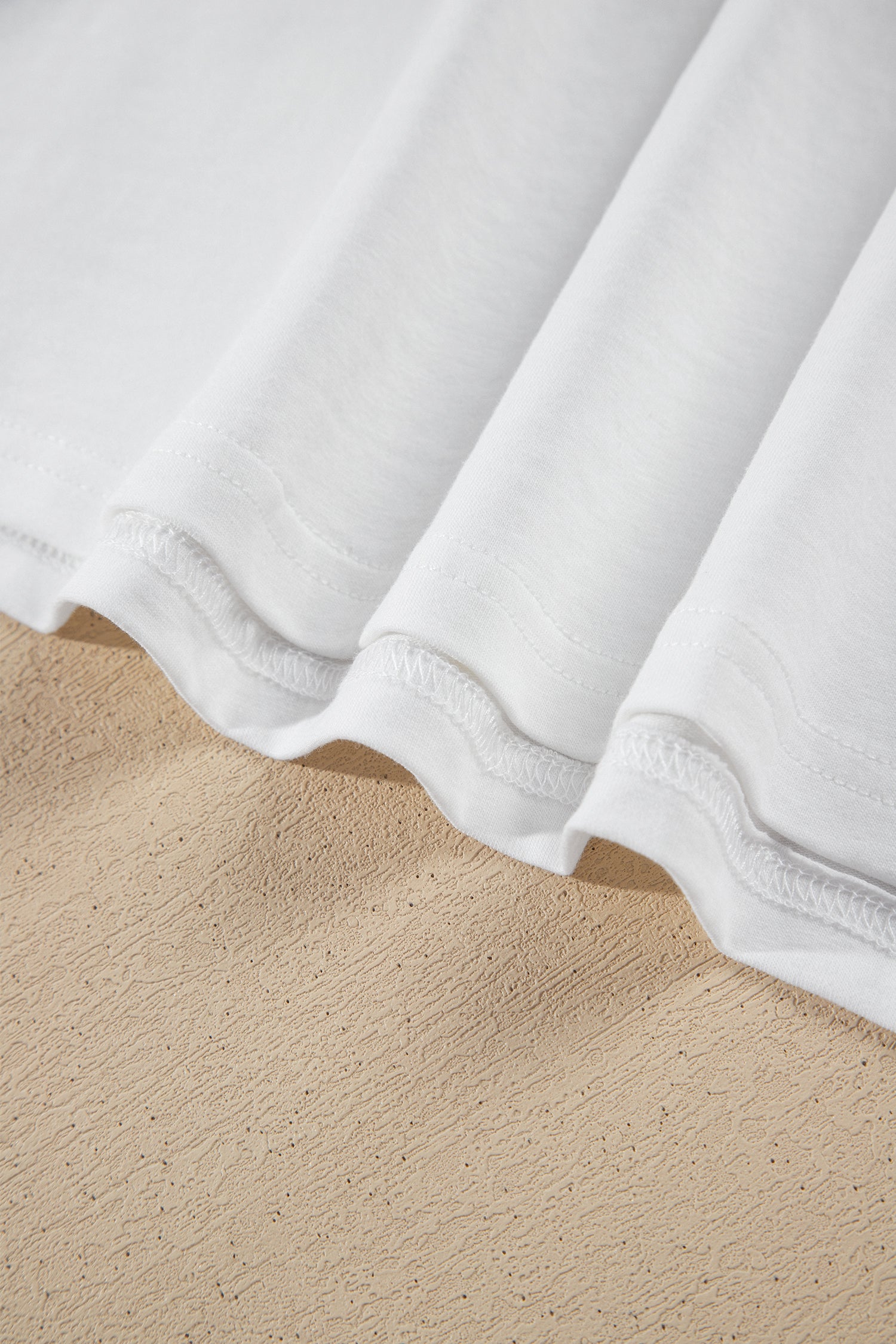 White contrast under-layer hem of the pink crop top