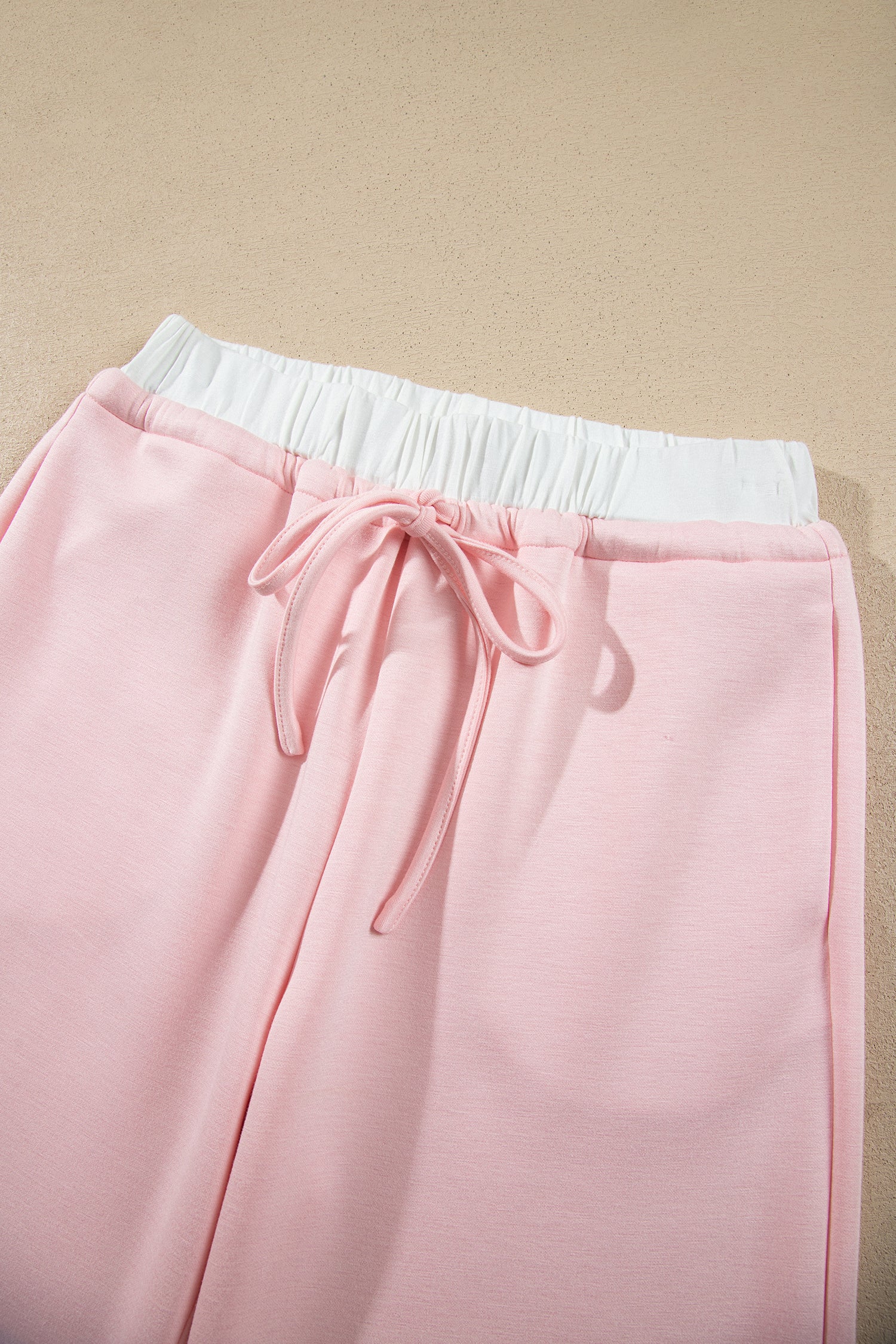 Pink wide leg pants white elastic waistband and drawstring detail