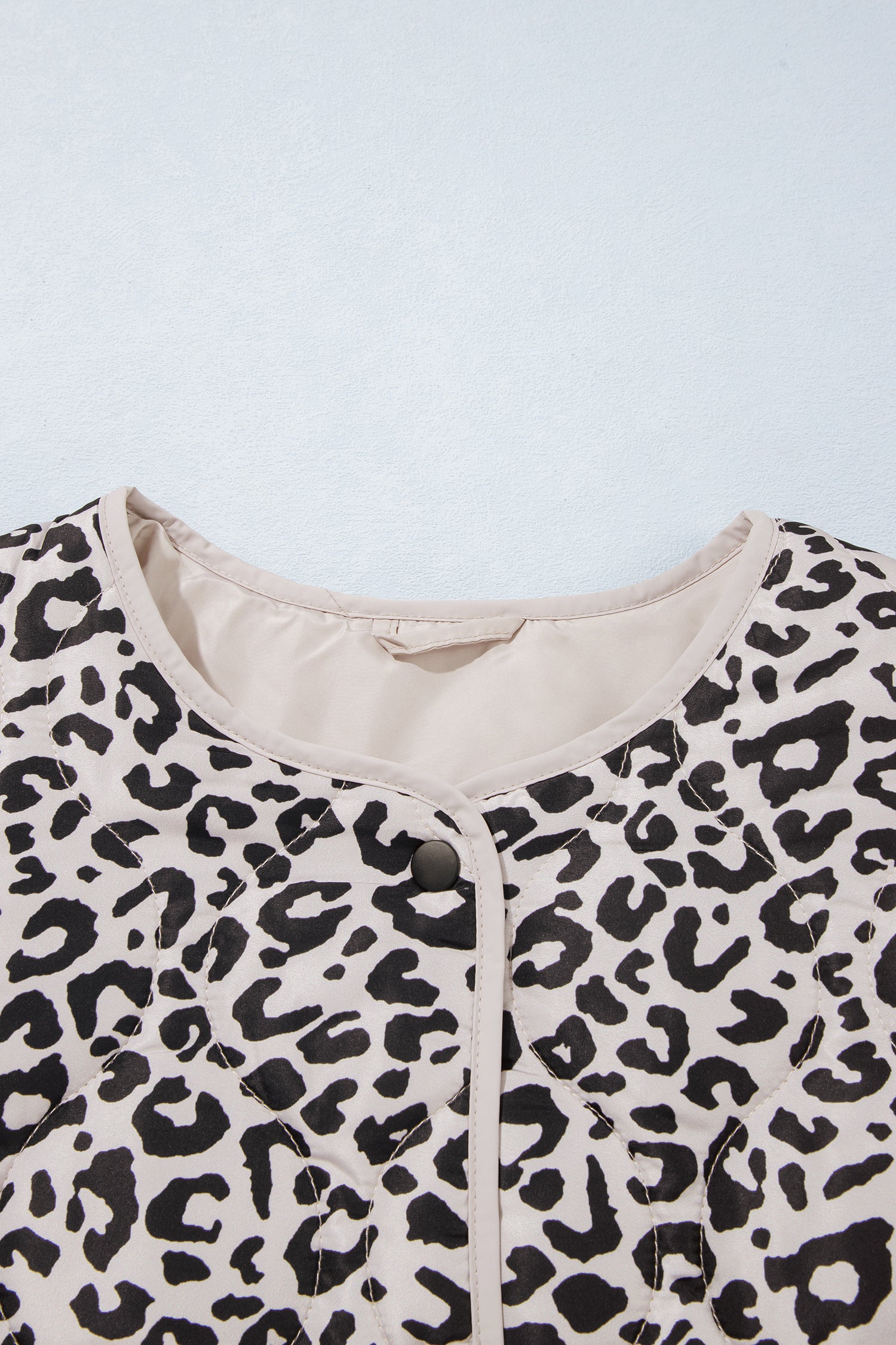 Leopard quilted jacket collarless round neckline with cream binding trim