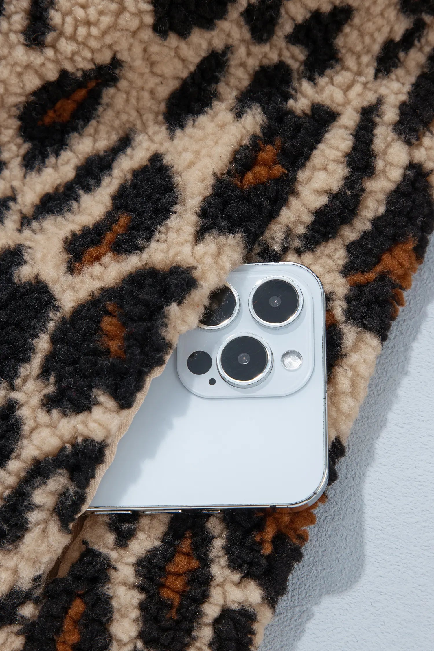 Close-up of plush khaki leopard print sherpa fabric