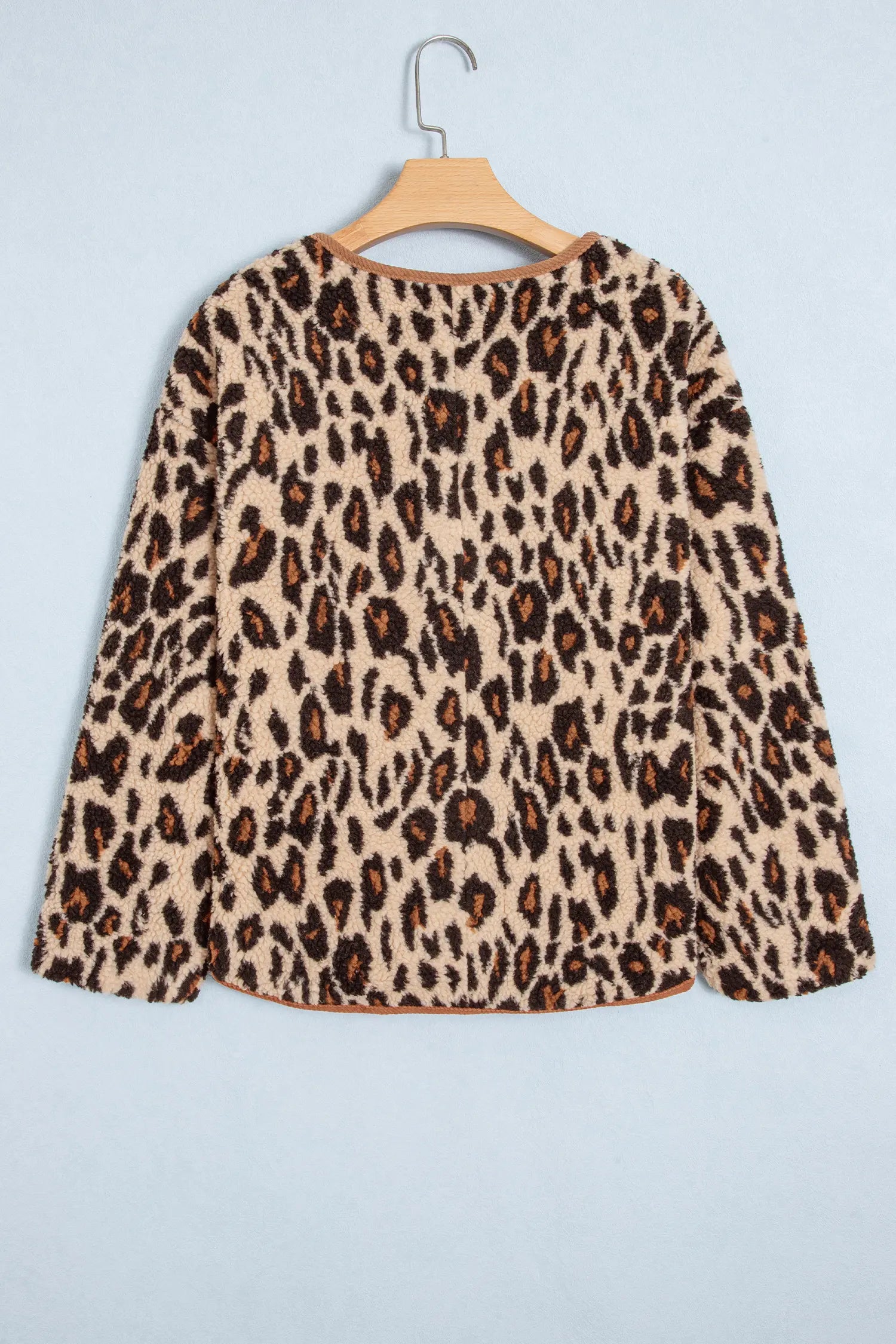 Khaki leopard sherpa jacket on a hanger, back view