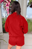 Back view of red mock neck sweatshirt and shorts set