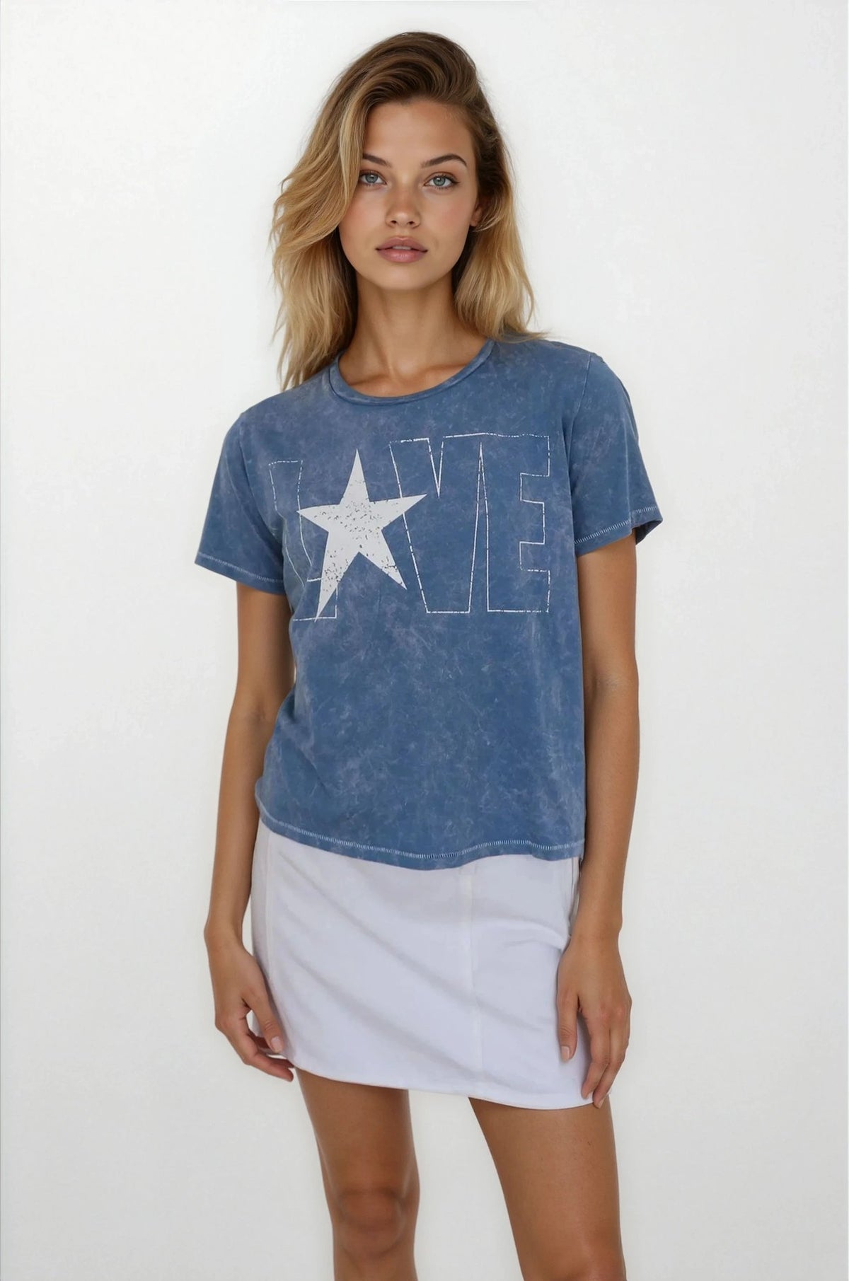 Woman wearing a blue t-shirt with a star and 'LOVE' graphic on a white background