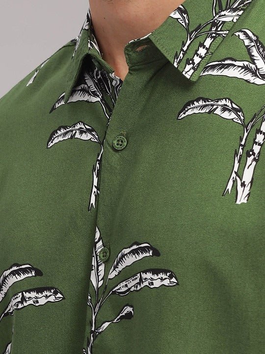 Green shirt with black palm tree pattern