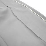 Close-up of gray fabric with a white line on a white background