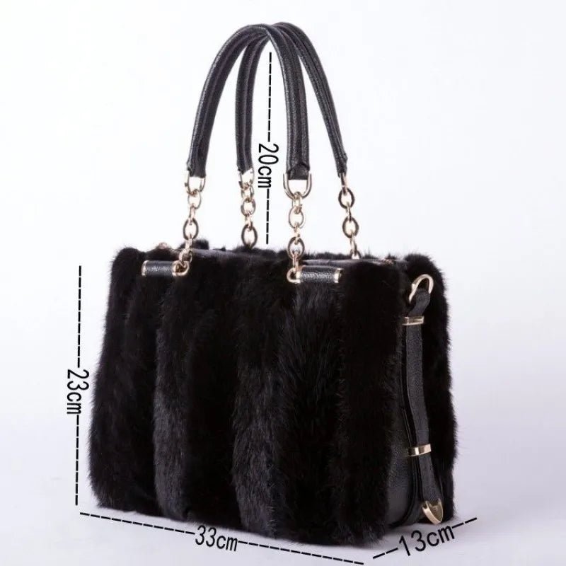 Black fur handbag with gold accents and measurements on a white background
