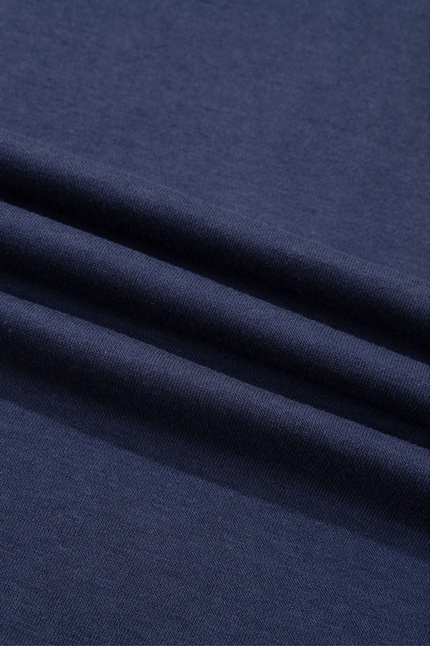 Navy blue cotton blend sweatshirt fabric texture, close-up
