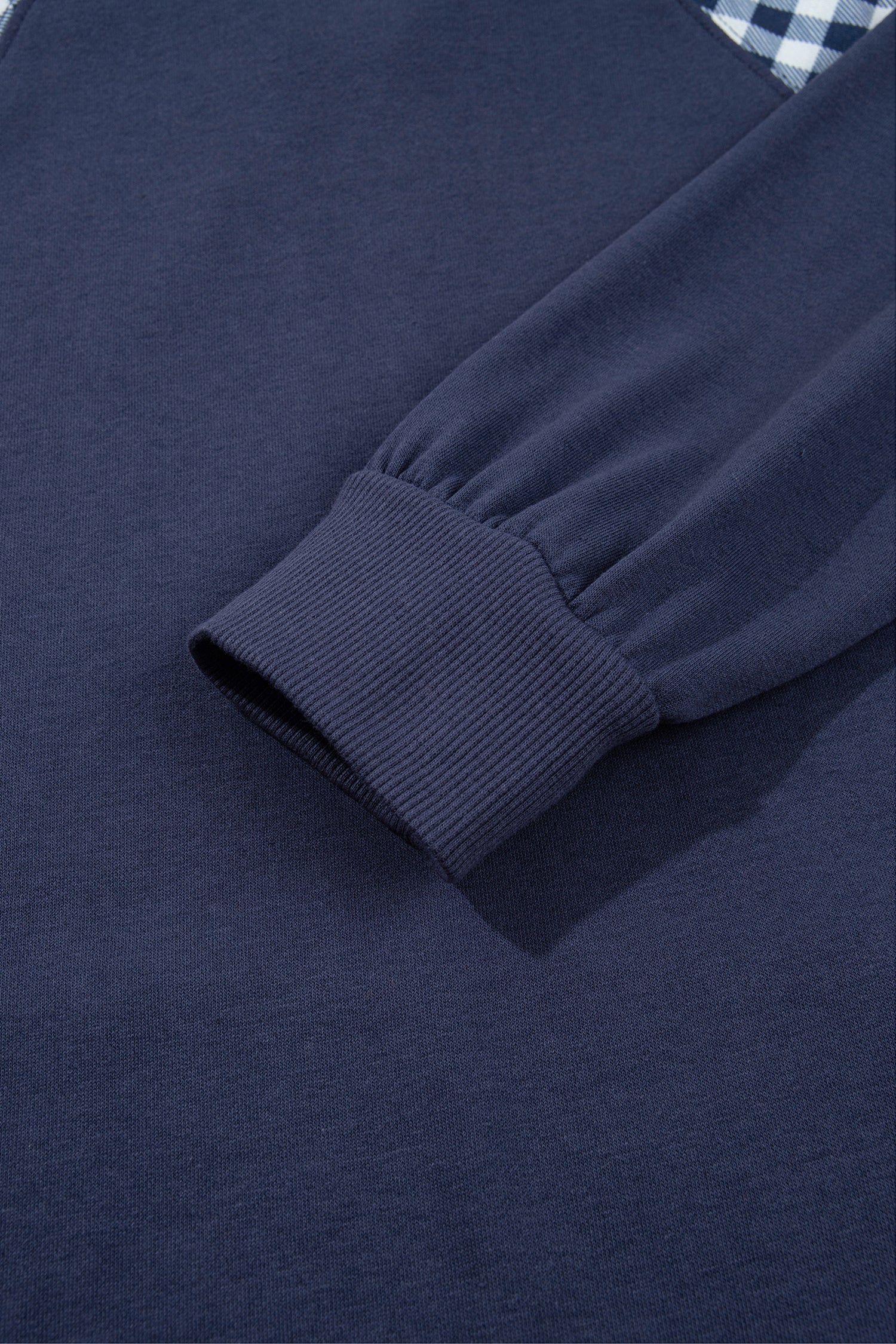 Navy blue sweatshirt ribbed hem detail