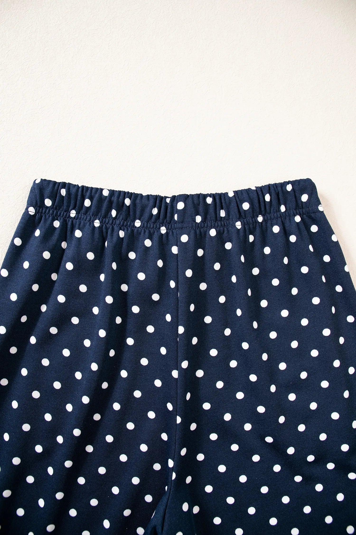 Elastic waistband on navy polka dot wide leg pants