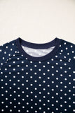 Ribbed crew neck and raglan seams on the navy polka dot top