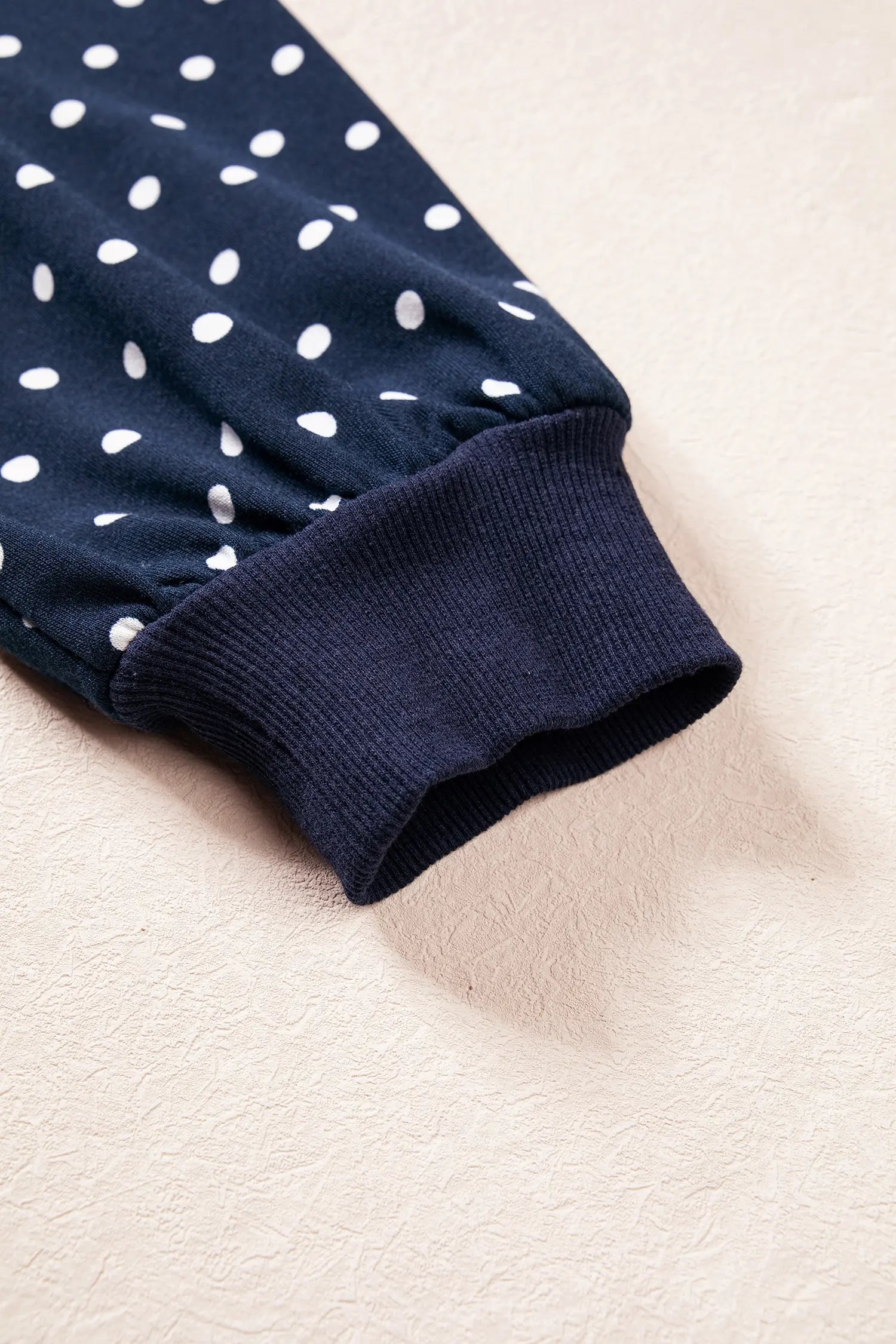 Ribbed cuff on the navy polka dot balloon sleeve top