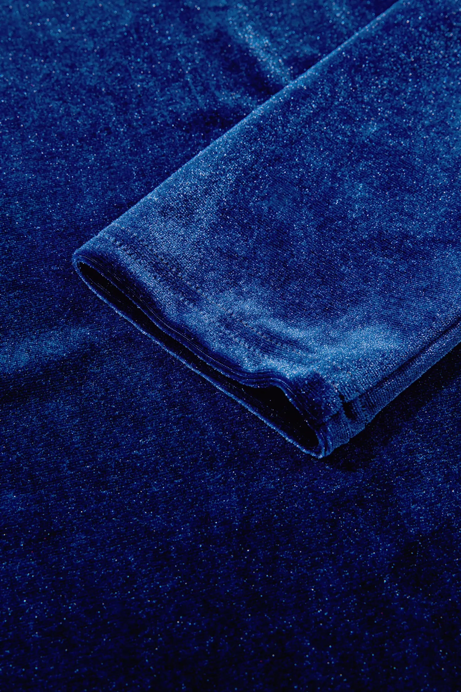 Sleeve cuff detail on navy stretch velvet top