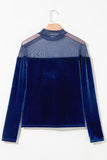 Navy velvet long sleeve top with sheer mesh yoke on a hanger, back view