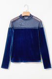 Navy velvet long sleeve top with sheer mesh yoke on a hanger, front view