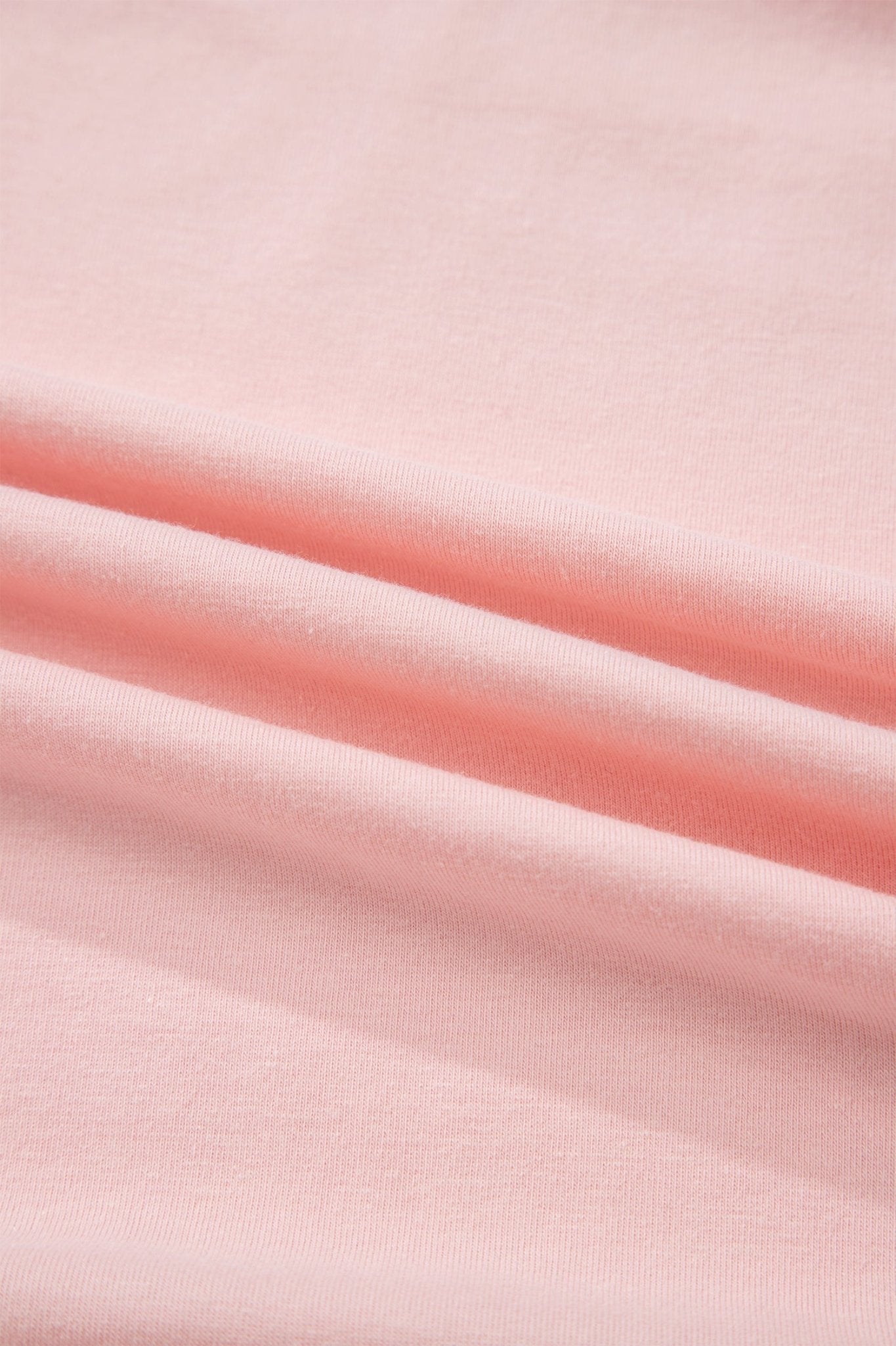 Close-up of pink fabric with a soft texture
