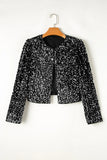 Black sequin jacket on a hanger against a white background