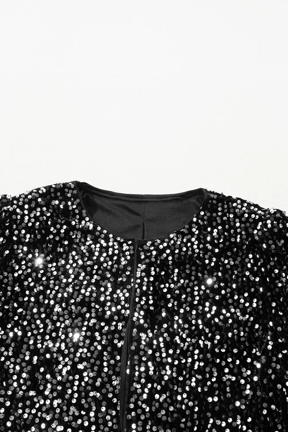 Black sequin jacket on a white background