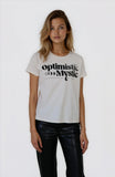 Woman wearing a white t-shirt with 'optimistic Mystic' text on a plain background