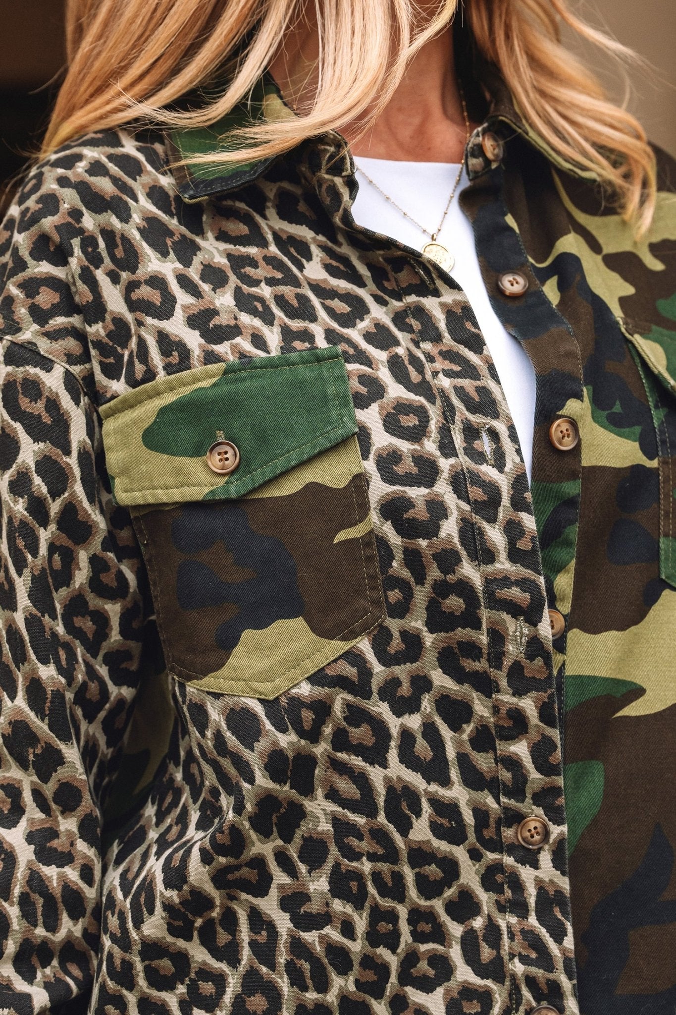Leopard print jacket with camouflage pocket and green accents