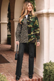 Woman wearing a camouflage jacket over a leopard print shirt with black pants, standing outdoors.