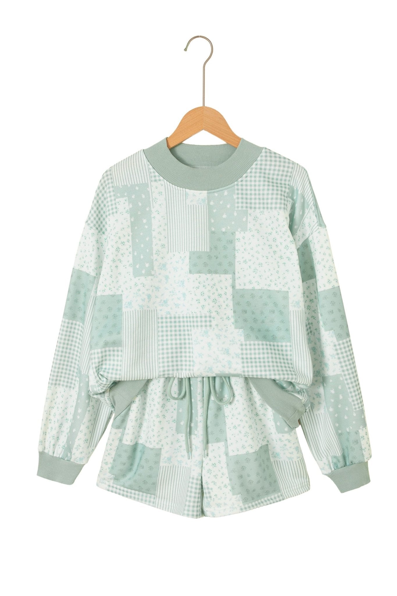 Children’s light green patchwork pajama set with striped, polka dot, and gingham patterns