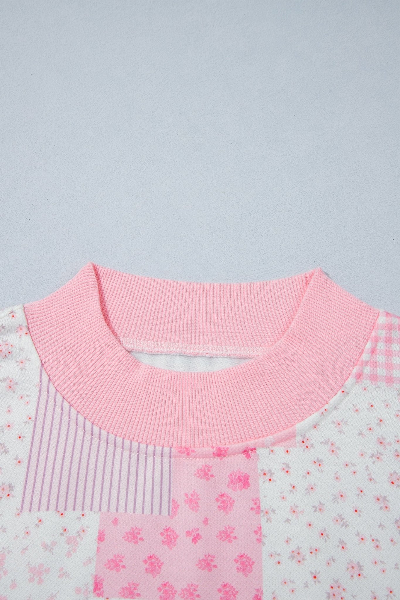 Two-piece pink floral and pattern patchwork sweatshirt and high-waisted shorts set