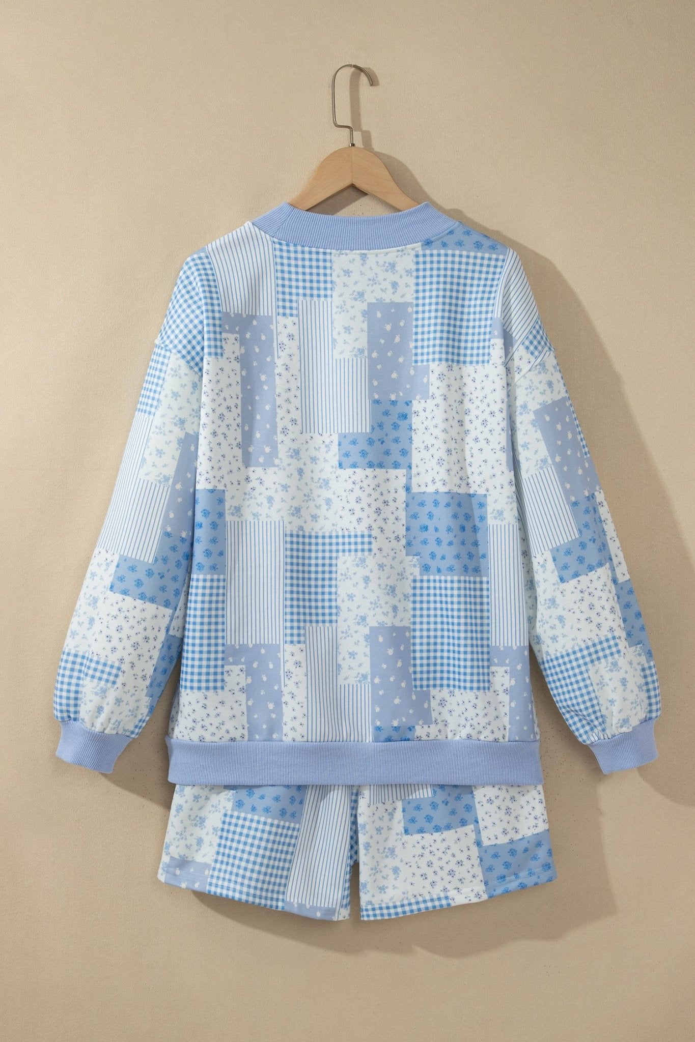 Sage green floral and check patchwork oversized sweatshirt and high-waist shorts set selfie.