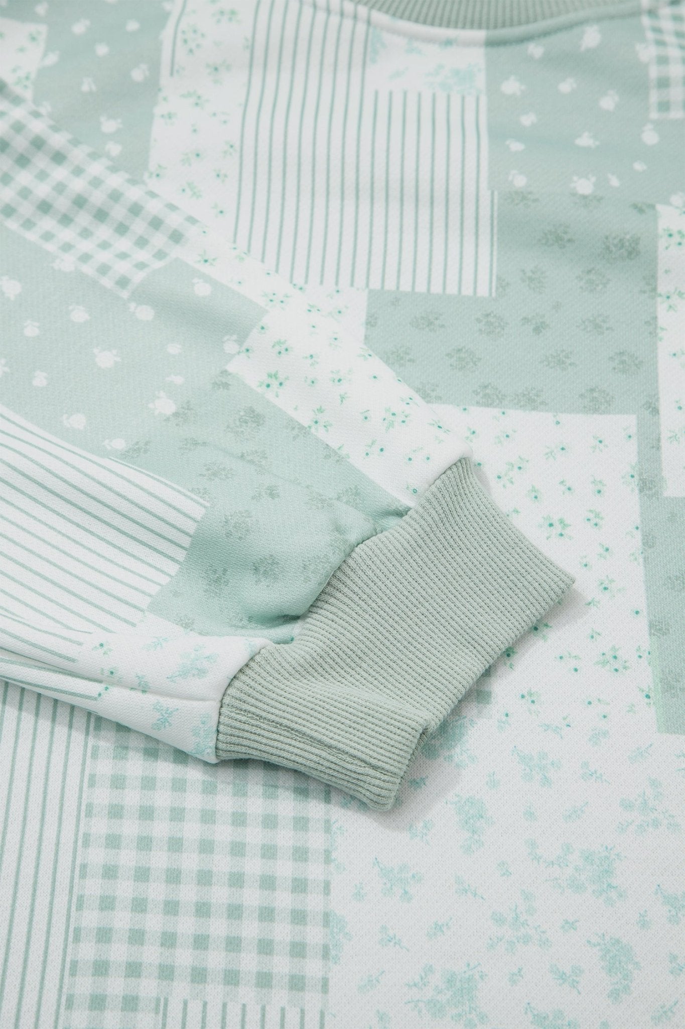 Two-piece floral patchwork loungewear set with crewneck sweatshirt and shorts