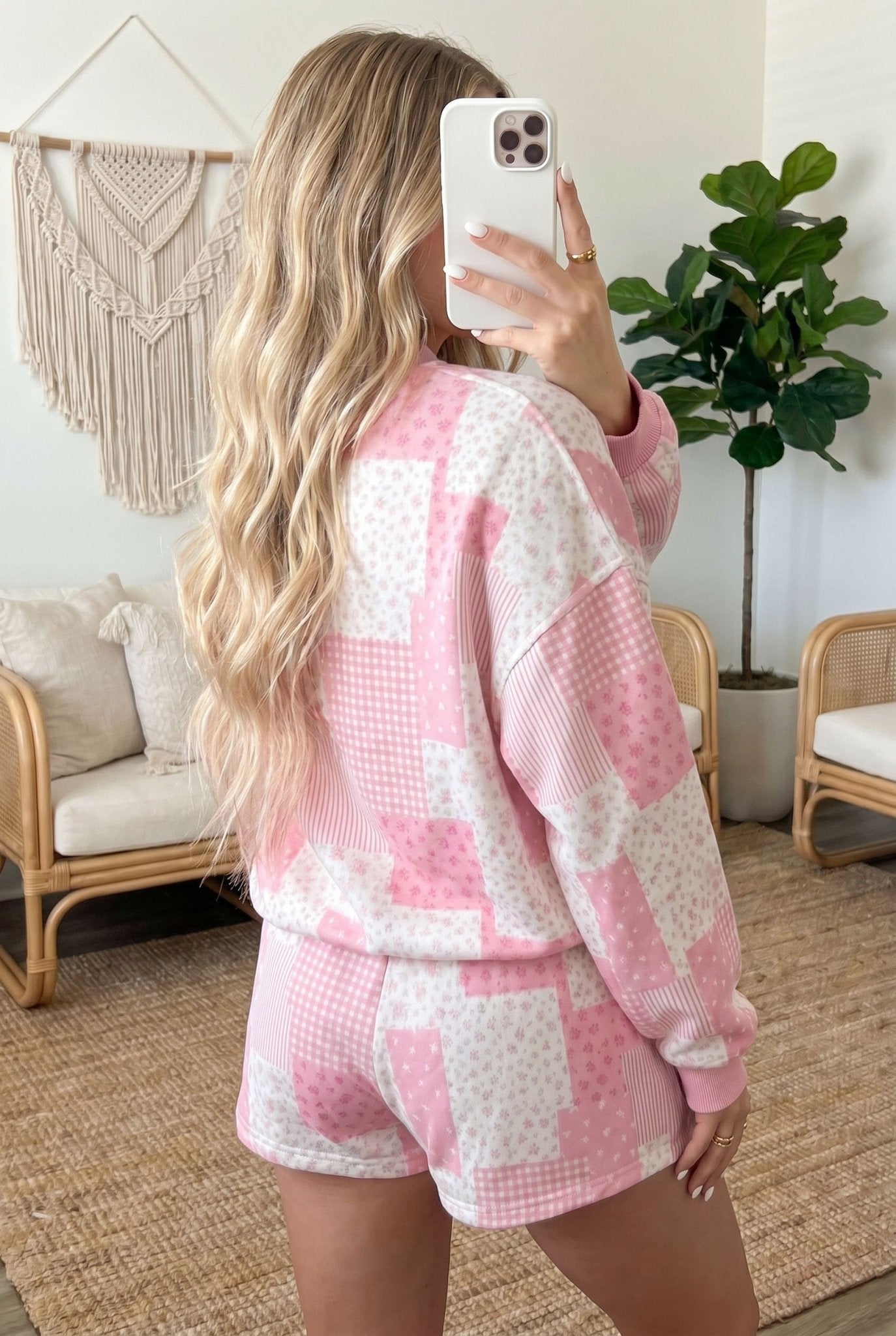 floral patchwork two-piece set featuring a drop-shoulder sweatshirt and shorts.