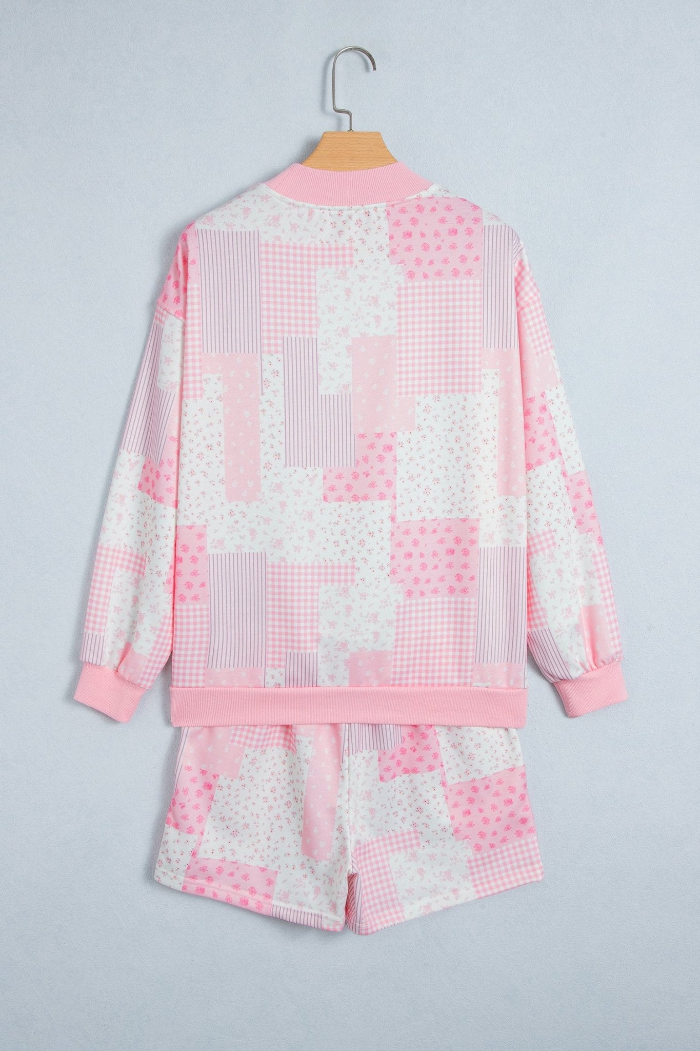 pink floral patchwork loungewear set with long-sleeve top and elastic shorts selfie.