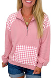 Women's pink quarter zip pullover with gingham shoulders, styled with denim