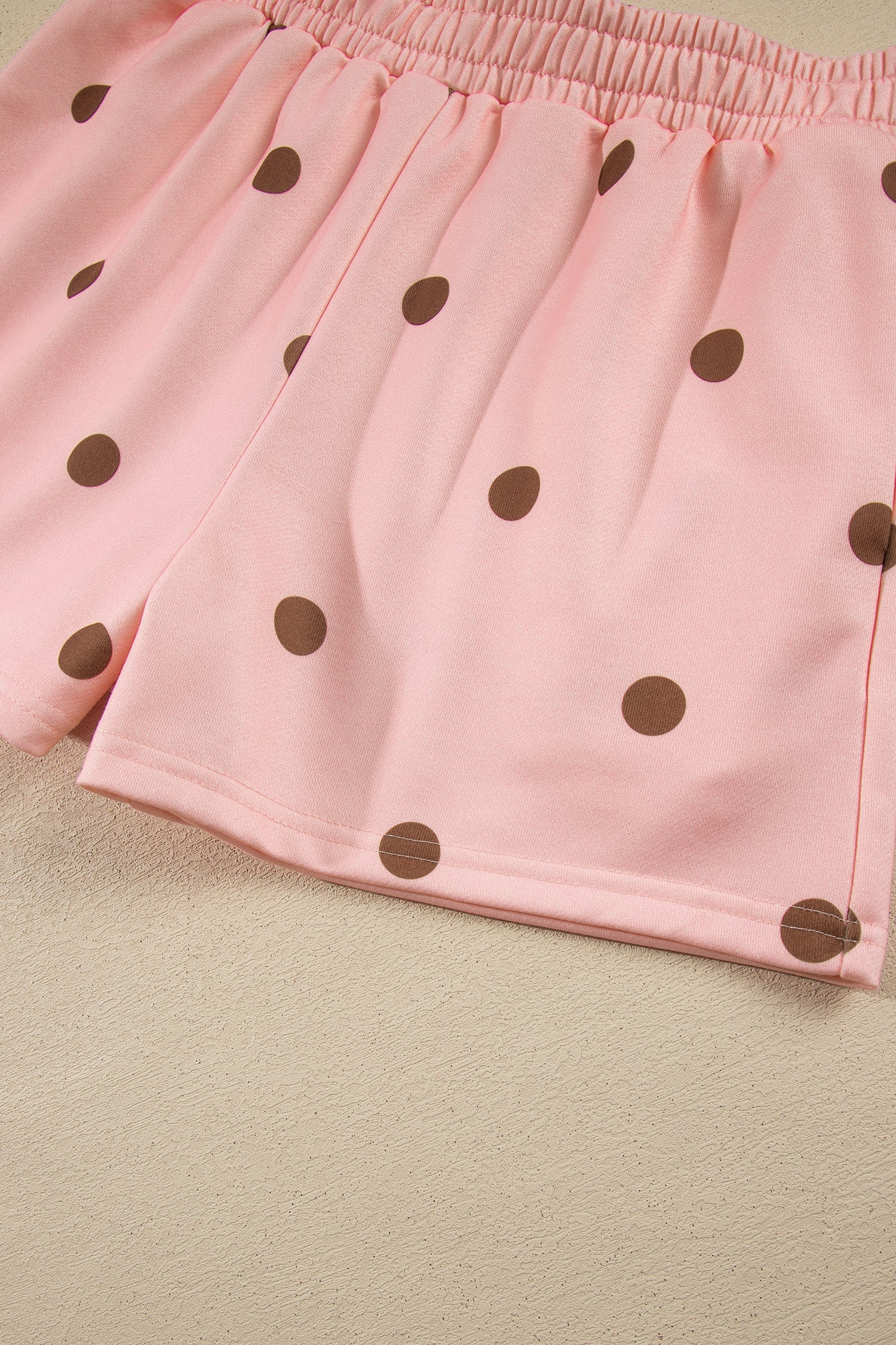 Hem detail of pink polka dot shorts