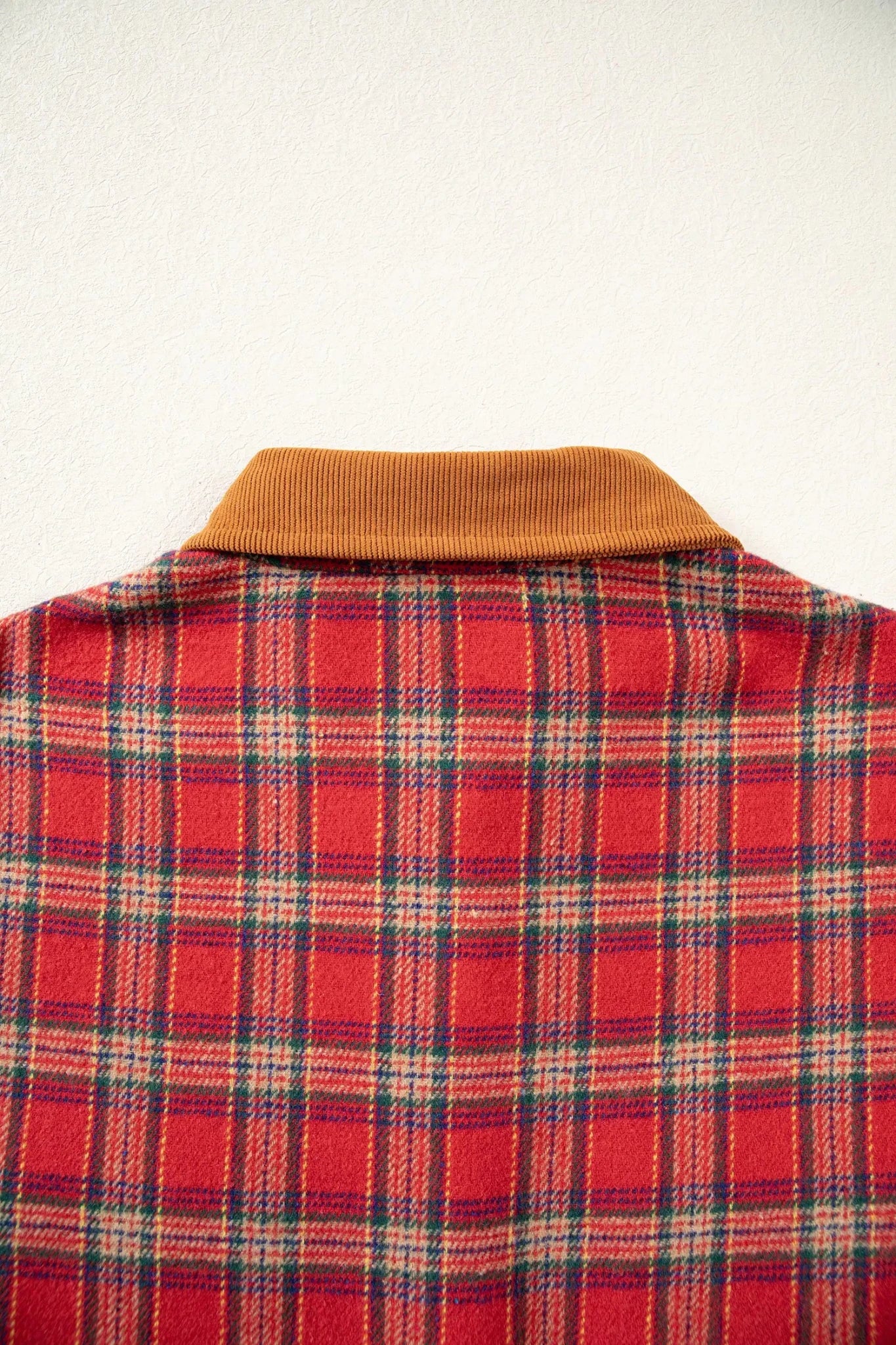 Red-beige plaid shirt jacket with brown corduroy collar .