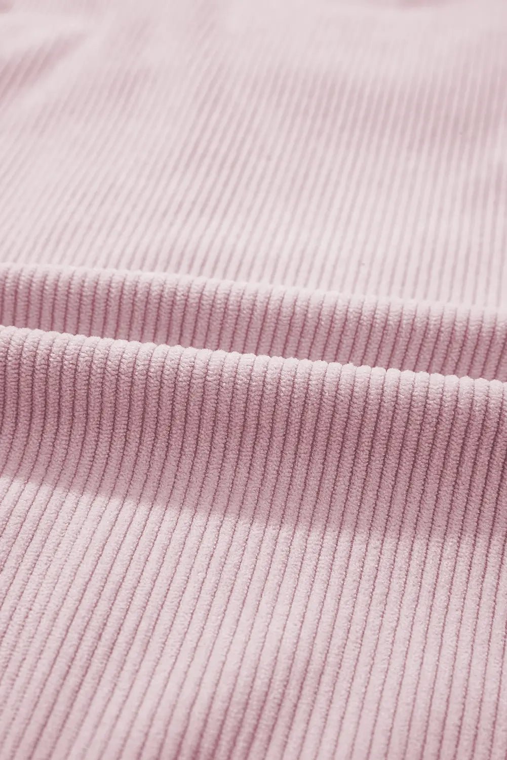 Close-up of pink ribbed fabric texture