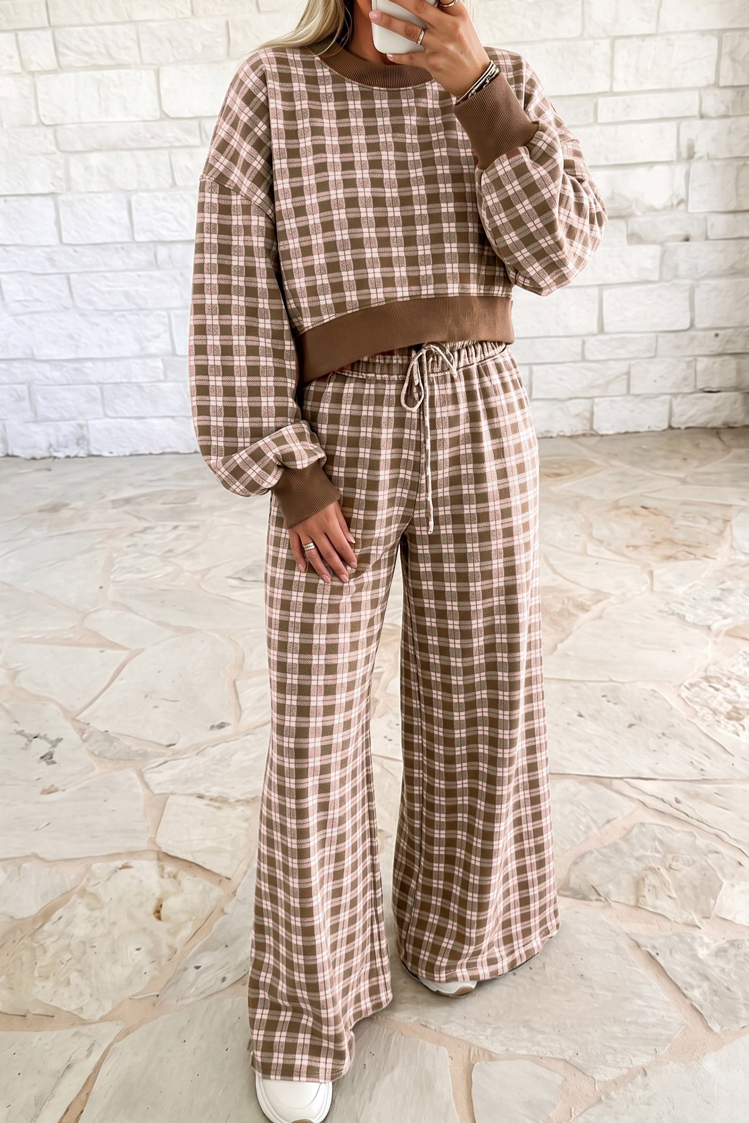 Woman in brown plaid cropped top and wide leg pants set with ribbed brown trim