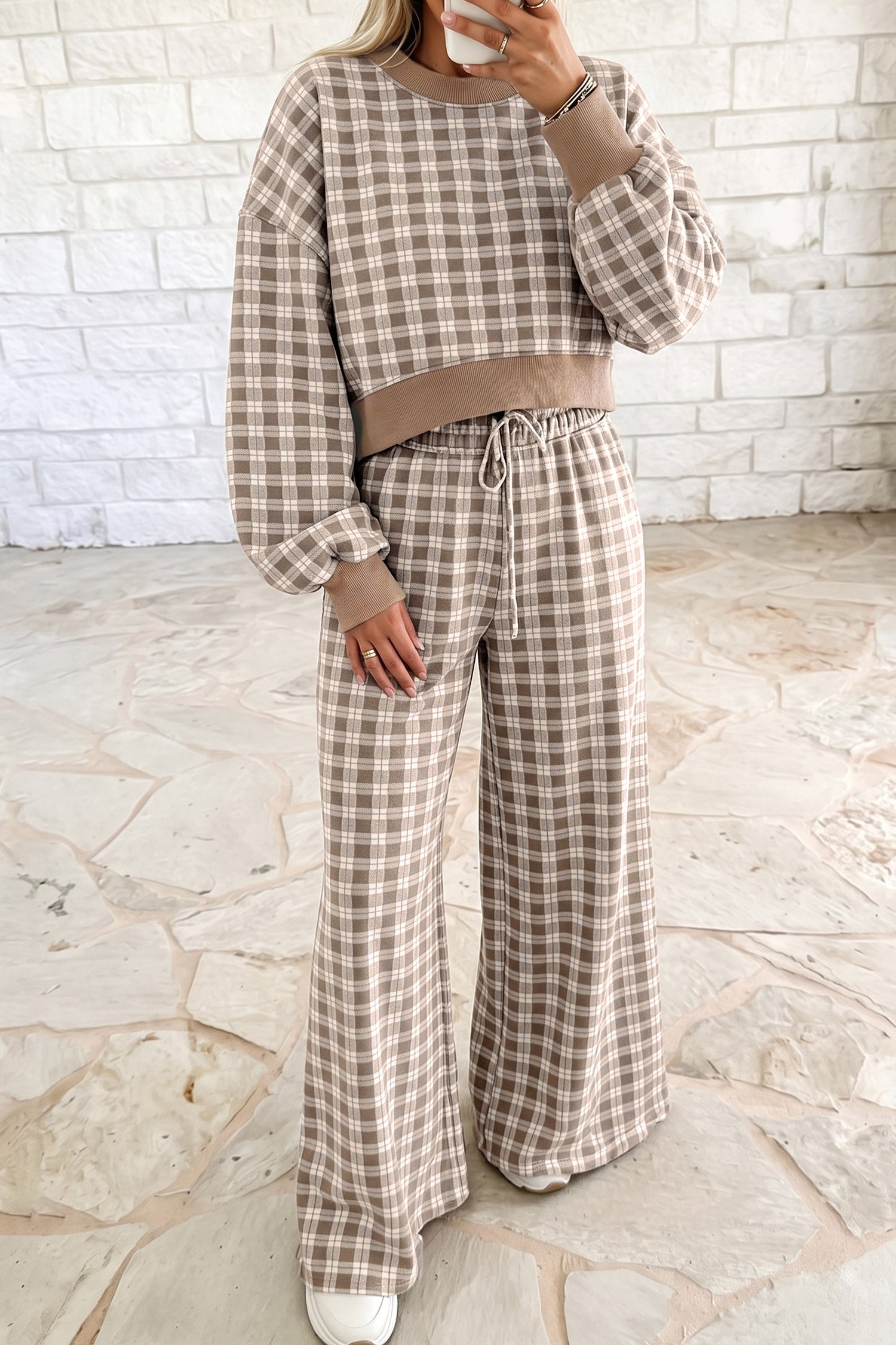 Woman in khaki plaid cropped top and wide leg drawstring pants set with ribbed trim