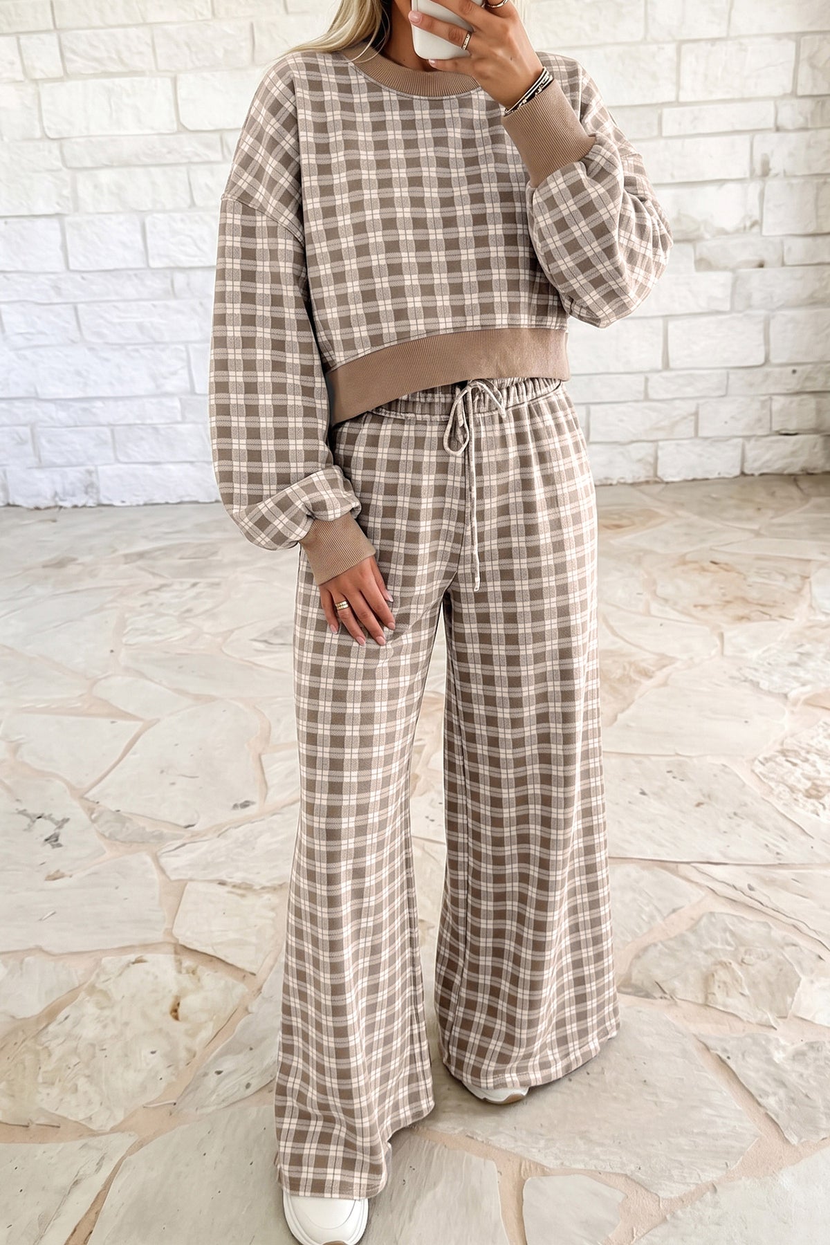 Woman in khaki plaid cropped top and wide leg drawstring pants set with ribbed trim