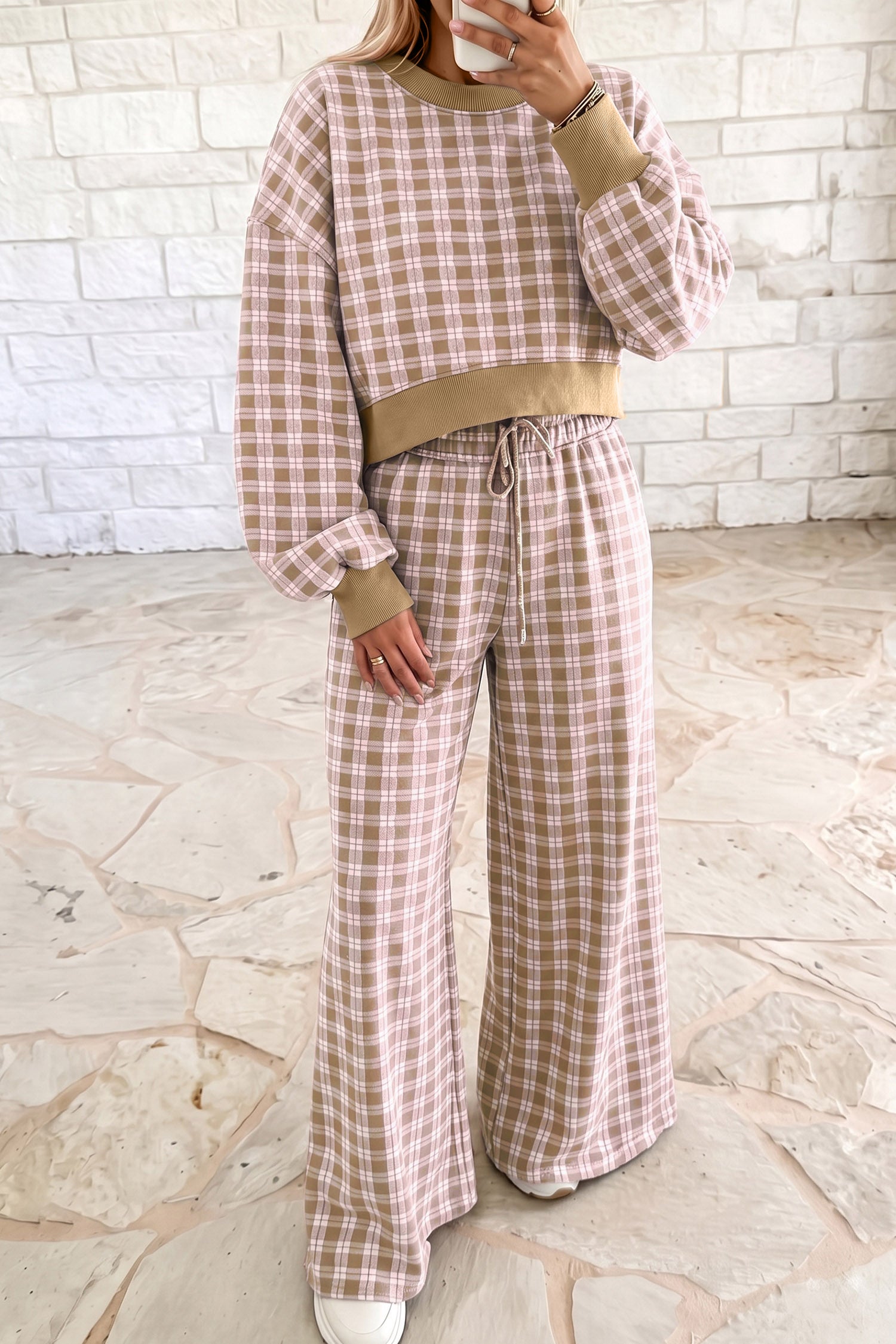 Woman in pink plaid cropped top and wide leg pants set with ribbed khaki trim