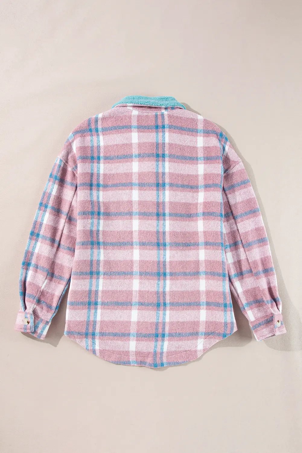 A pink and white plaid flannel shirt with light blue stripes, shown from the back on a neutral beige background.
