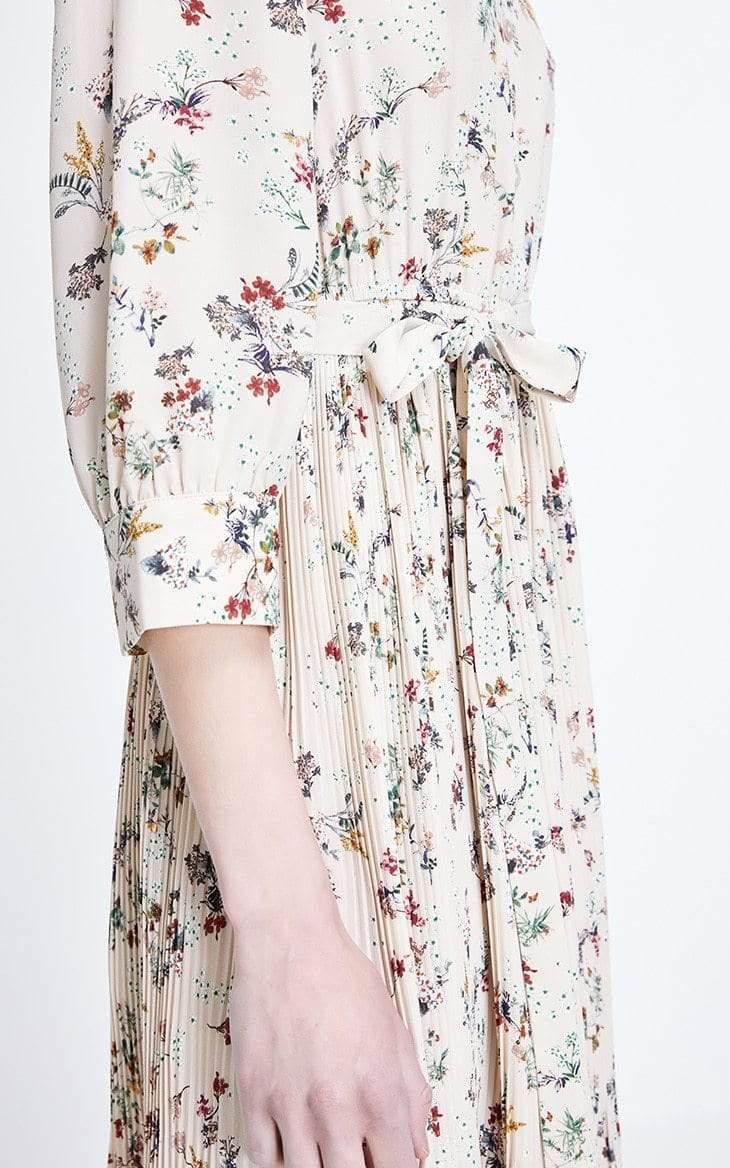 Floral patterned dress with a tie waist on a white background